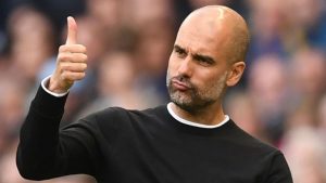 Man City boss Pep Guardiola gives a thumbs up to one of his players. (Getty Images)
