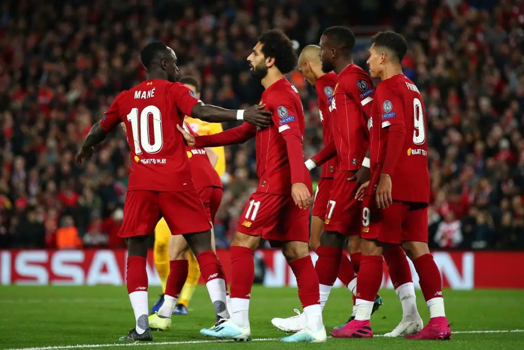 Liverpool players walk after scoring. (Getty Images)