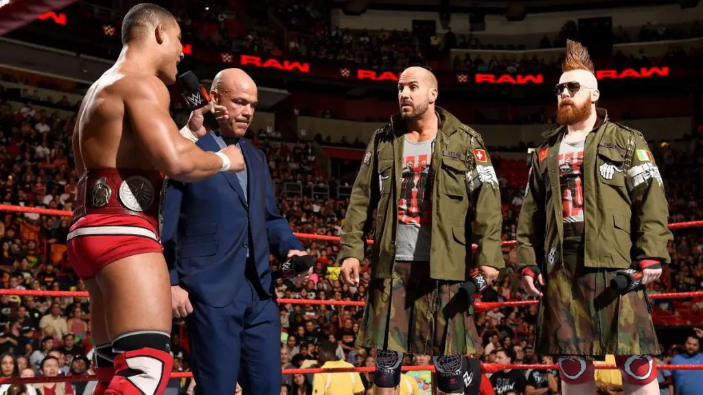 Jason Jordan (L) and Kurt Angle talk to Cesaro and Sheamus (R). (WWE)