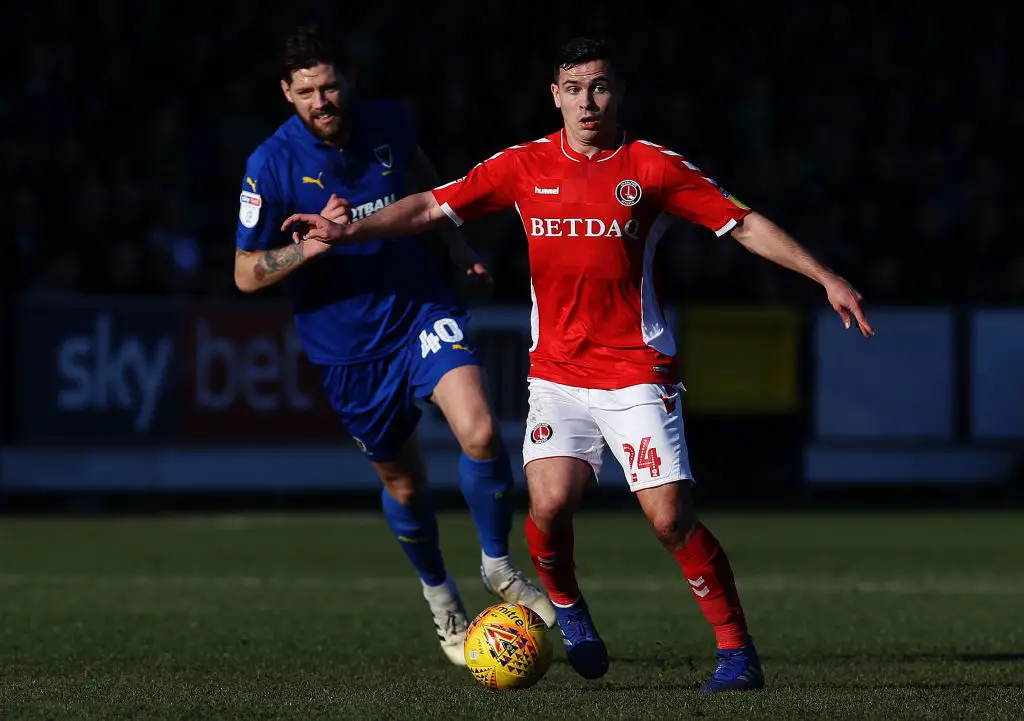 Josh Cullen of Charlton Athletic shield the ball from Anthony Wordsworth of AFC Wimbledon during the Sky Bet League One match between AFC Wimbledon. (Getty Images)
