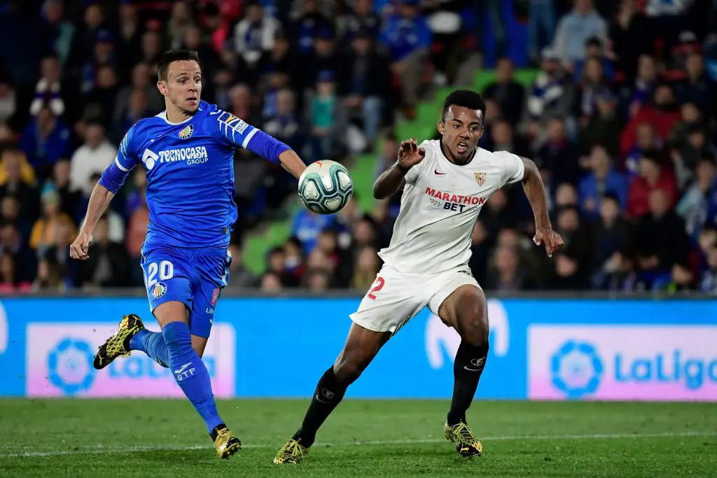 Getafe's Serbian midfielder Nemanja Maksimovic (L) and Sevilla's French defender Jules Kounde run for the ball during the Spanish league football match Getafe CF against Sevilla FC at the Coliseum Alfonso Perez stadium. (Getty Images)