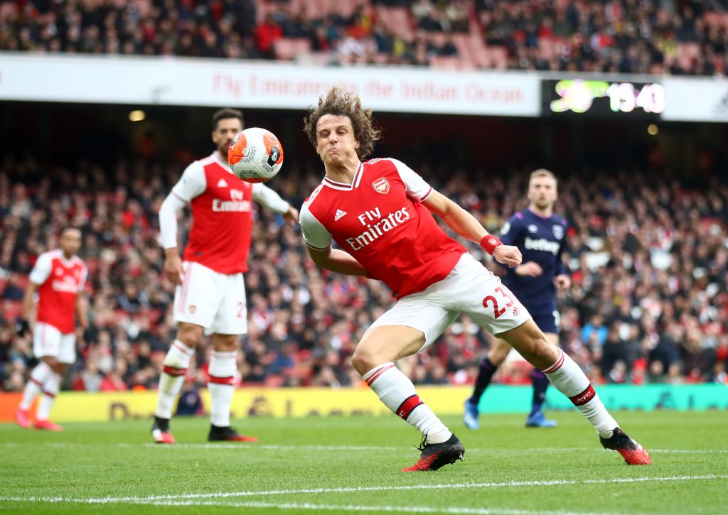 With Mustafi now gone, it would make sense for Arsenal to offer a new deal to their 33-year-old veteran star 1 Arsenal's David Luiz blocks a cross against West Ham (Getty Imgaes)