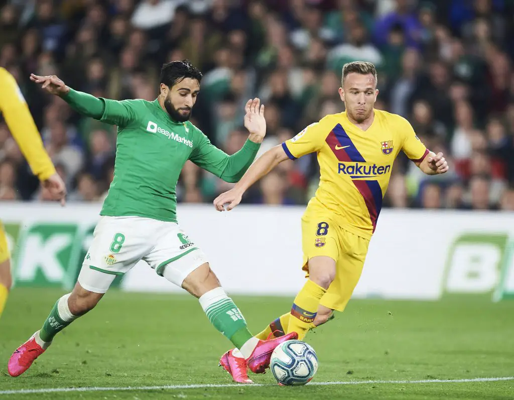 Arthur Melo (R) duels for the ball with Real Betis' Nabil fekir (Getty Images)