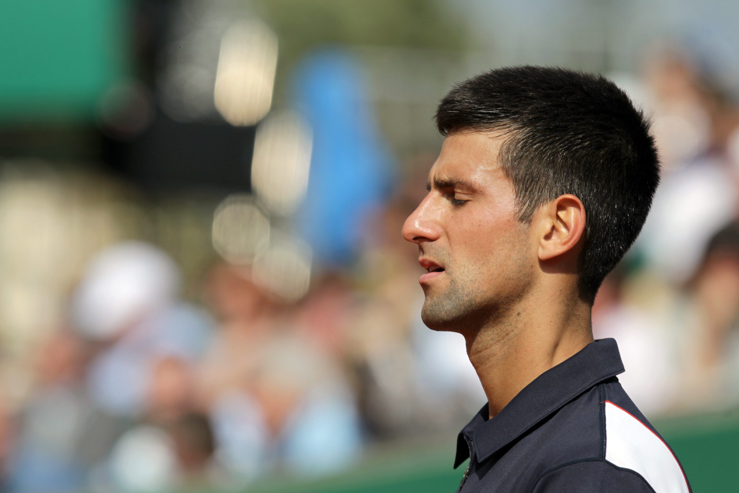 Novak Djokovic closing his eyes to meditate