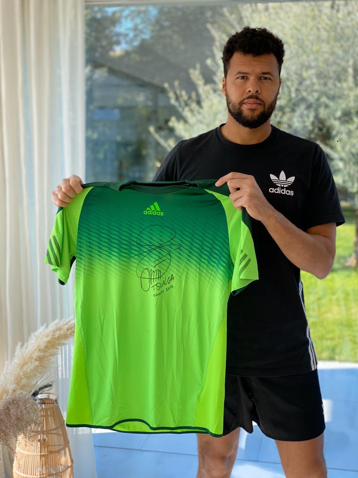 Jo Wilfred Tsonga with his autographed shirt that he is putting up for auction in the fight against COVID-19 virus.