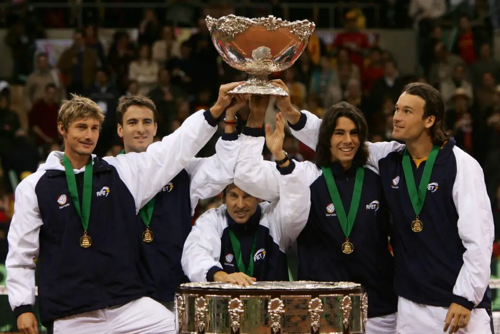 Spanish team members (from left to right) Juan Carlos Ferrero,Tommy Robredo, team captain Jordi Arrese, Rafael Nadal, and Carlos Moya pose with the Trophy during the Davis Cup award ceremony in December 2004 at La Cartuja Olympic Stadium in Seville.