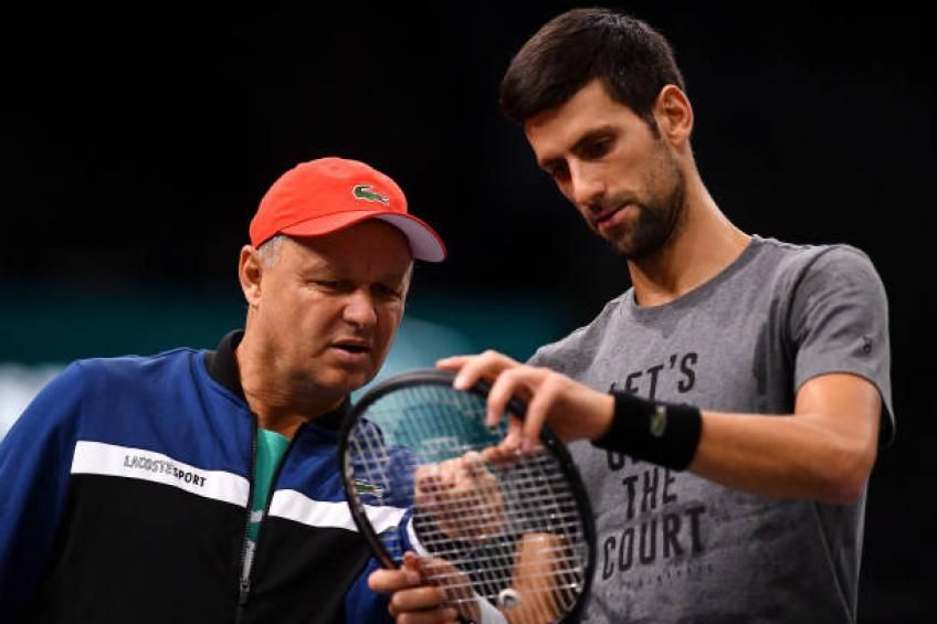 Serbian Novak Djokovic speaks to his head coach Marian Vajda during a training session.