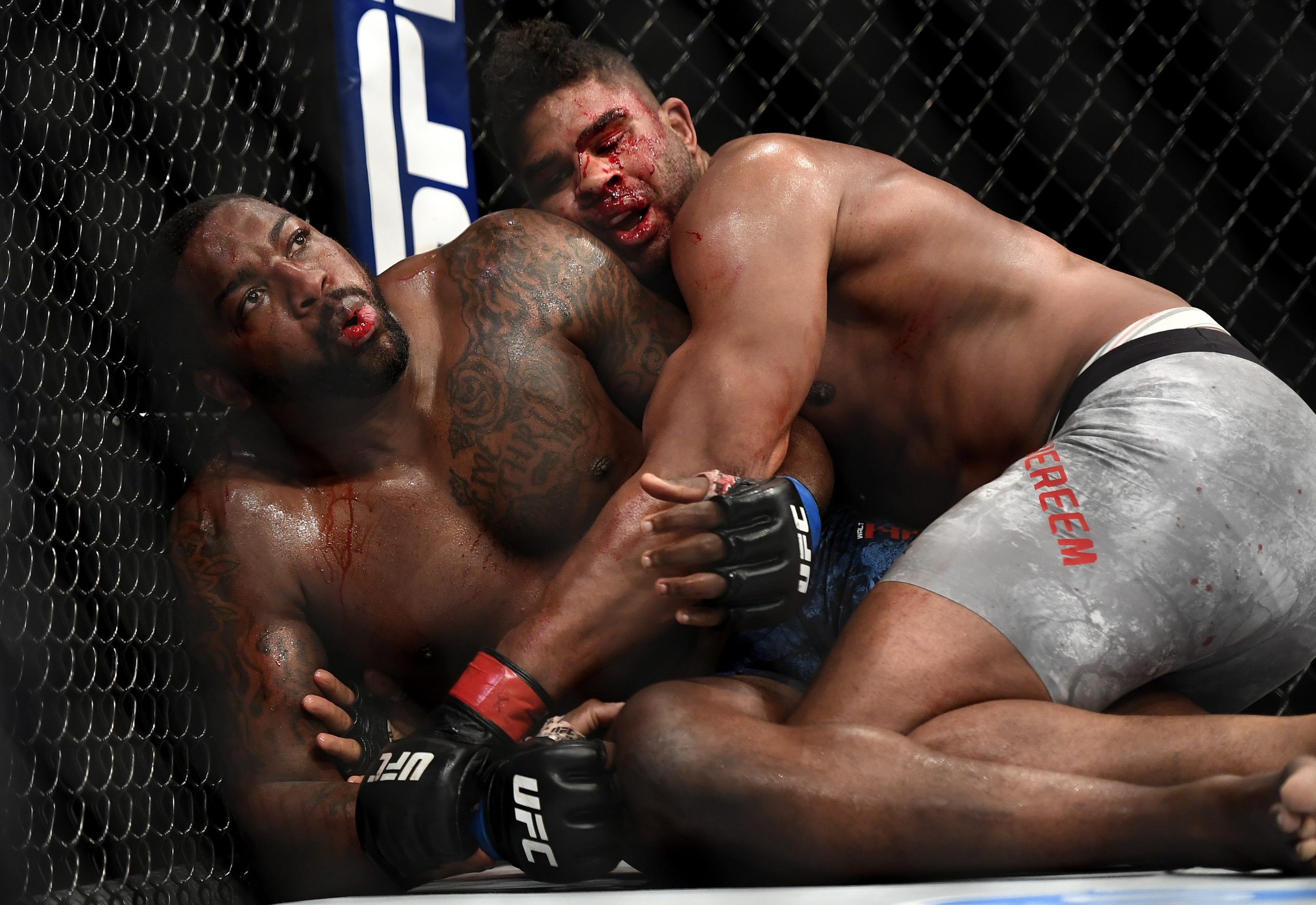 Alistair Overeem (top) fights Walt Harris in their Heavyweight bout during UFC...
