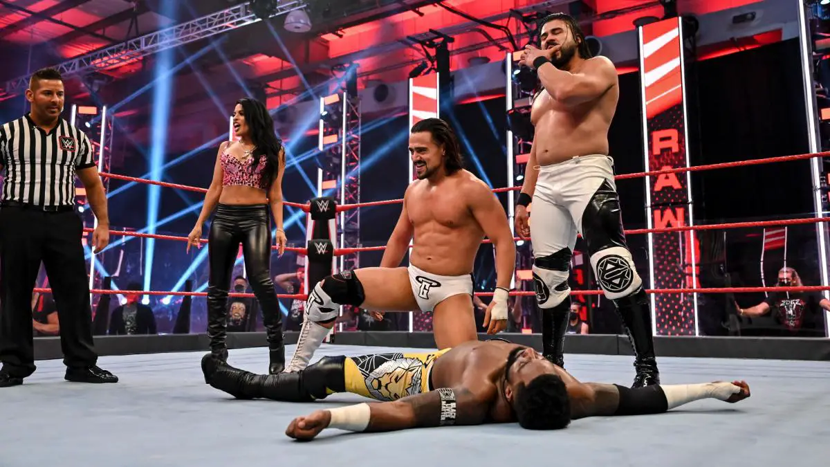 Angel Garza and Andrade celebrate after winning the triple threat match