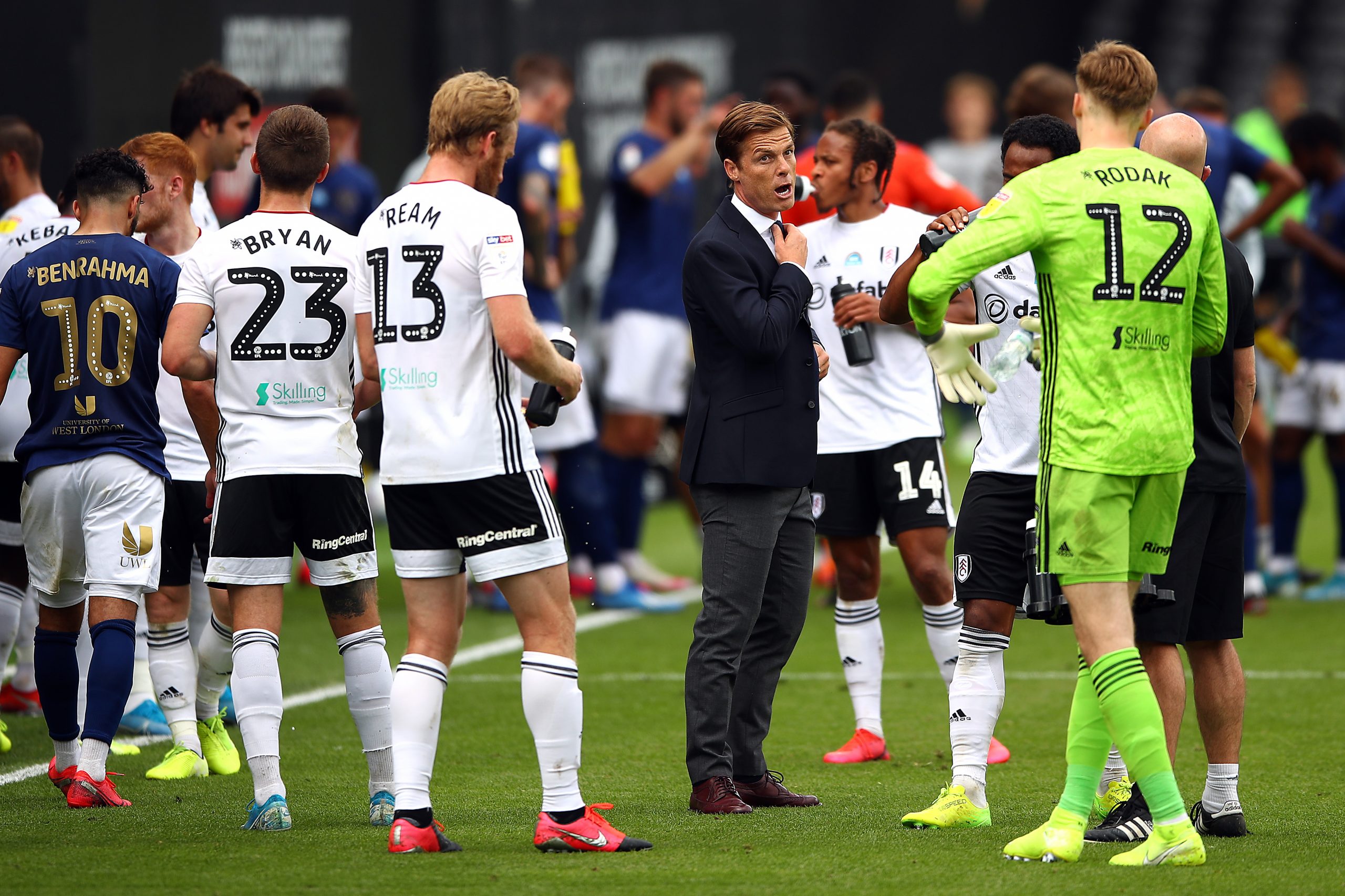 Fulham manager Scott Parker talks to his players during a break in play in the Sky Bet Championship match between Fulham and Brentford at Craven Cottage last month.