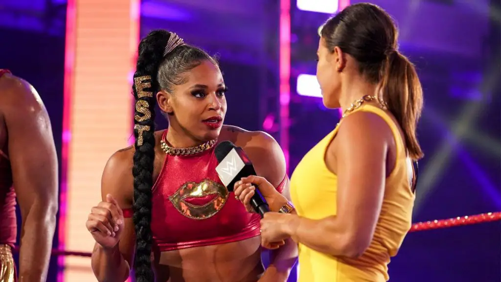Charly Caruso conducting an interview with Bianca Belair on WWE.