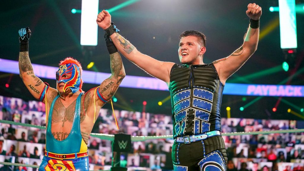 Dominik Mysterio and his father, Rey, celebrate