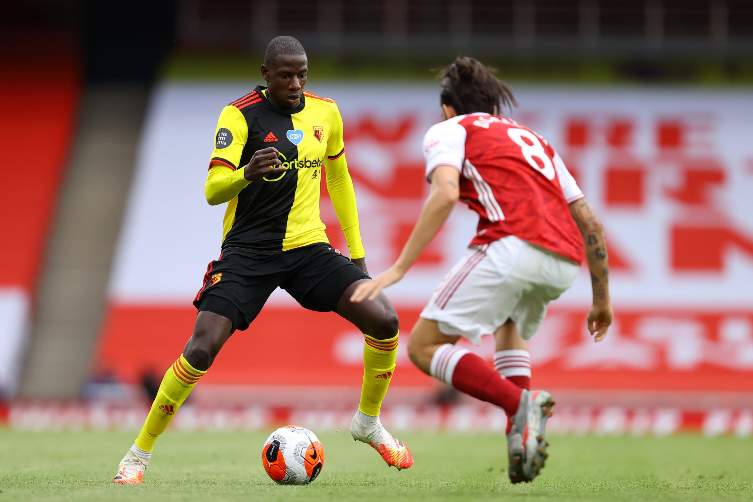 Abdoulaye Doucoure (L) in action against Arsenal (Getty Images)