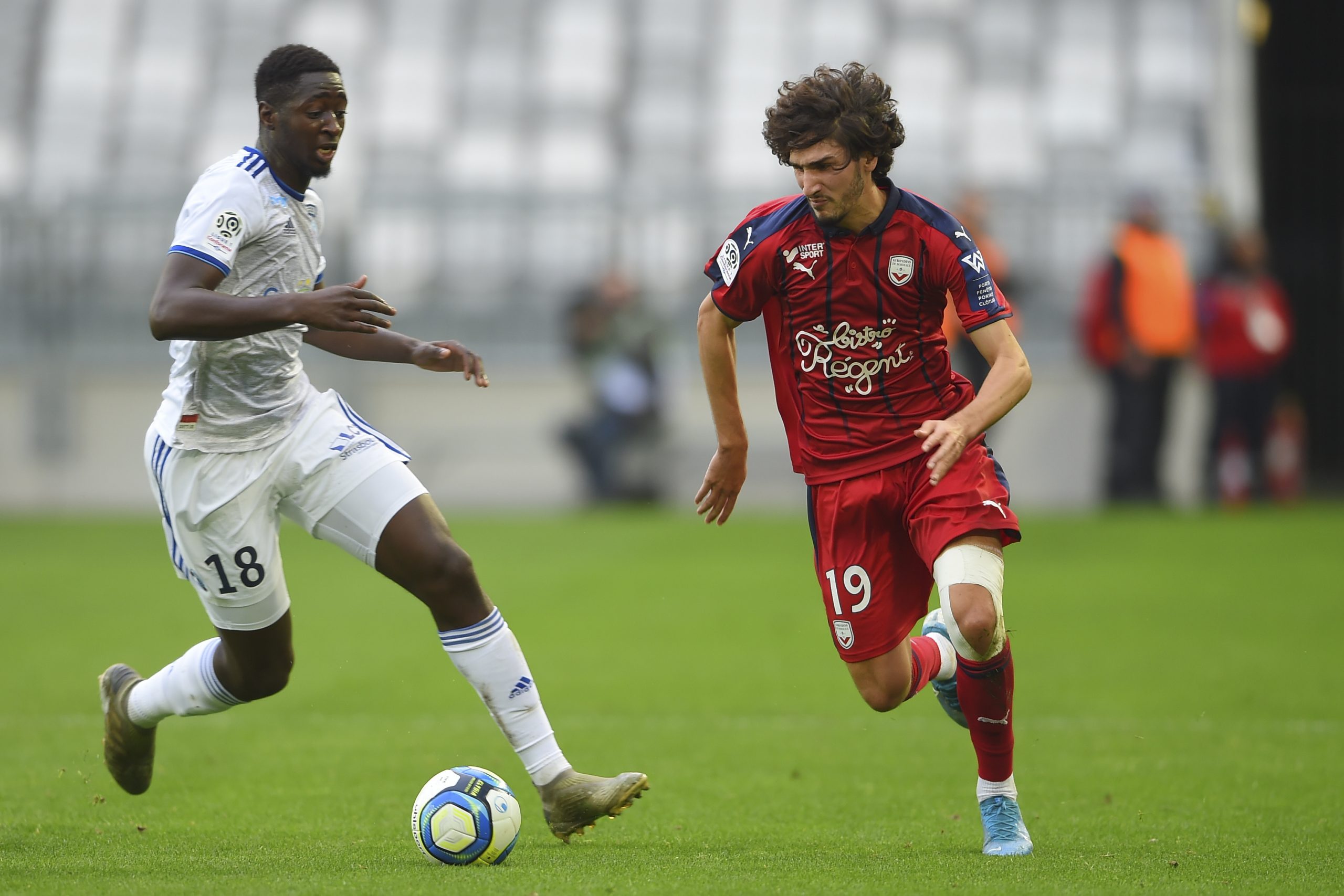 Bordeaux's French midfielder Yacine Adli (right) is challenged by Strasbourg's French midfielder Ibrahima Sissoko (left) during the French Ligue 1 football match between both the sides back in December.