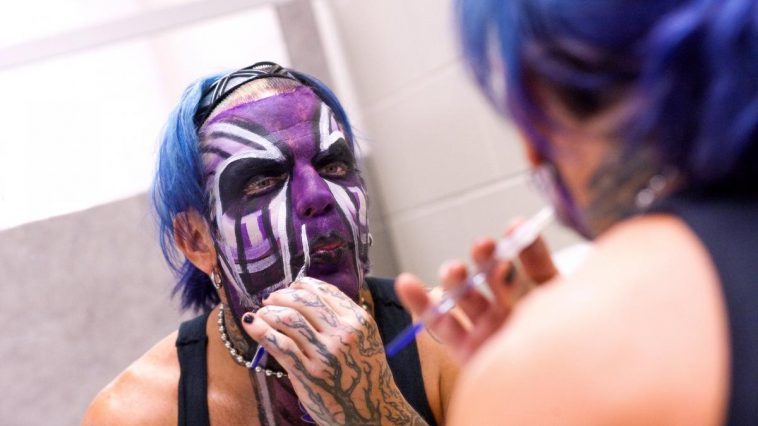 Jeff Hardy applies face paint before a show (WWE). 