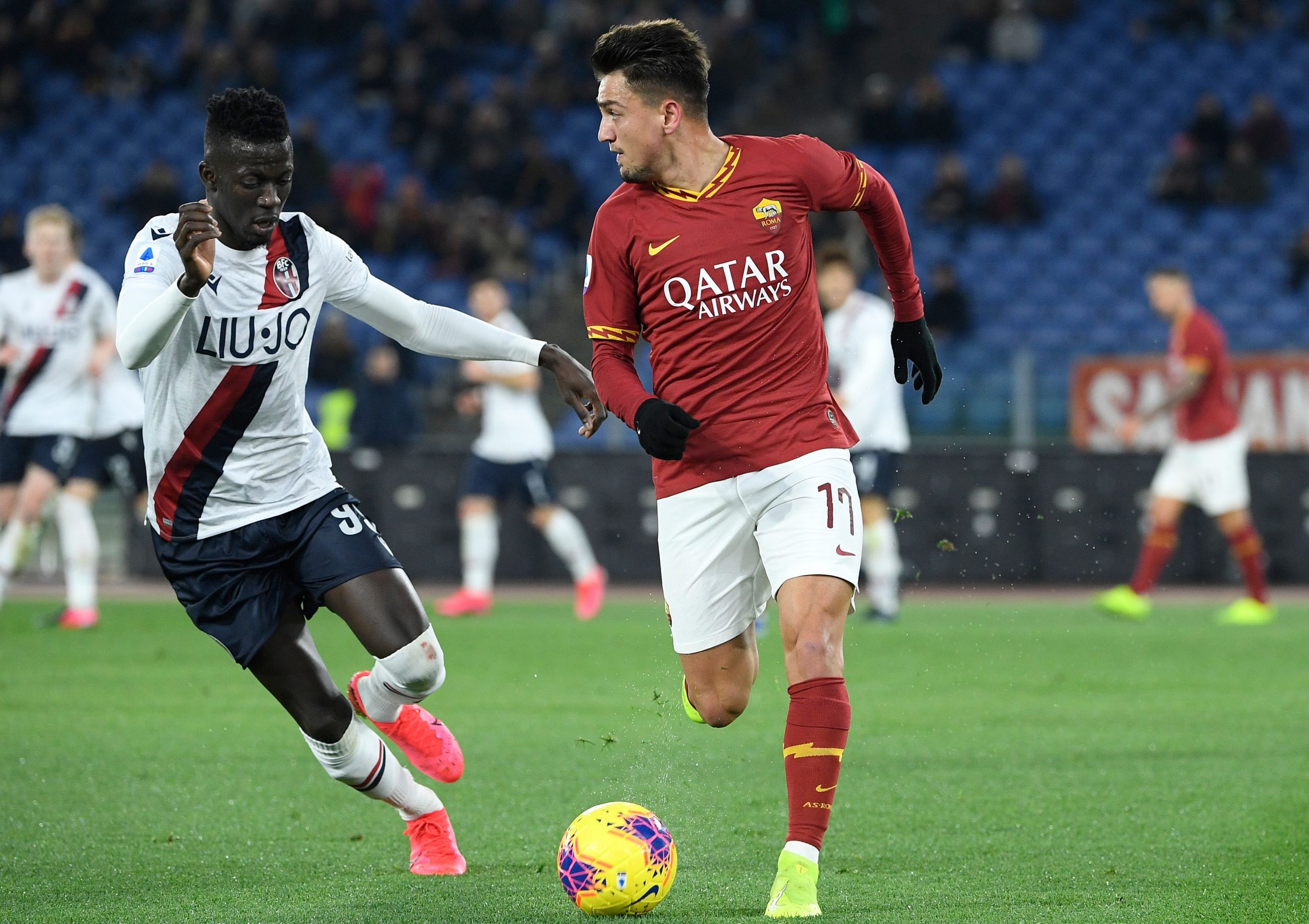 Cengiz Under (R) in action against Bologna (Getty Images)