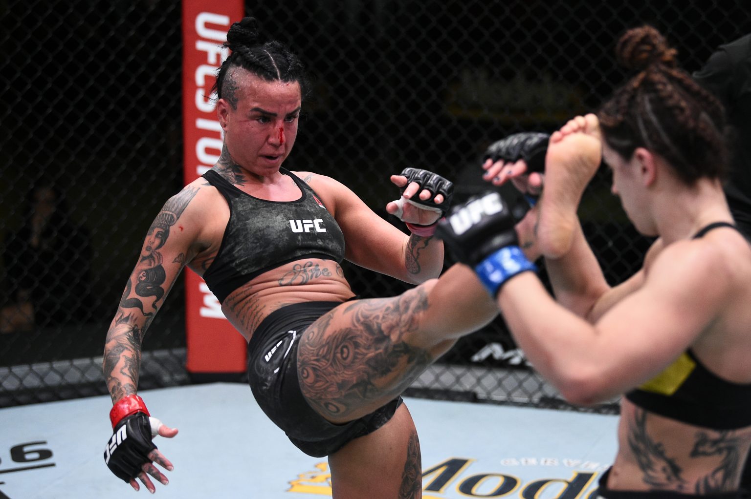 Ashlee Evans-Smith in action during a UFC fight. 