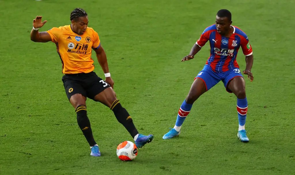 Wolverhampton Wanderer's Adama Traore and Crystal Palace's Tyrick Mitchell battle for the ball during the Premier League match at Molineux.