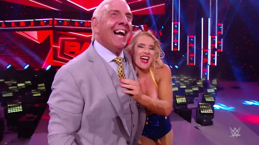 Ric Flair leaves with Lacey Evans after her win against Charlotte. (WWE)