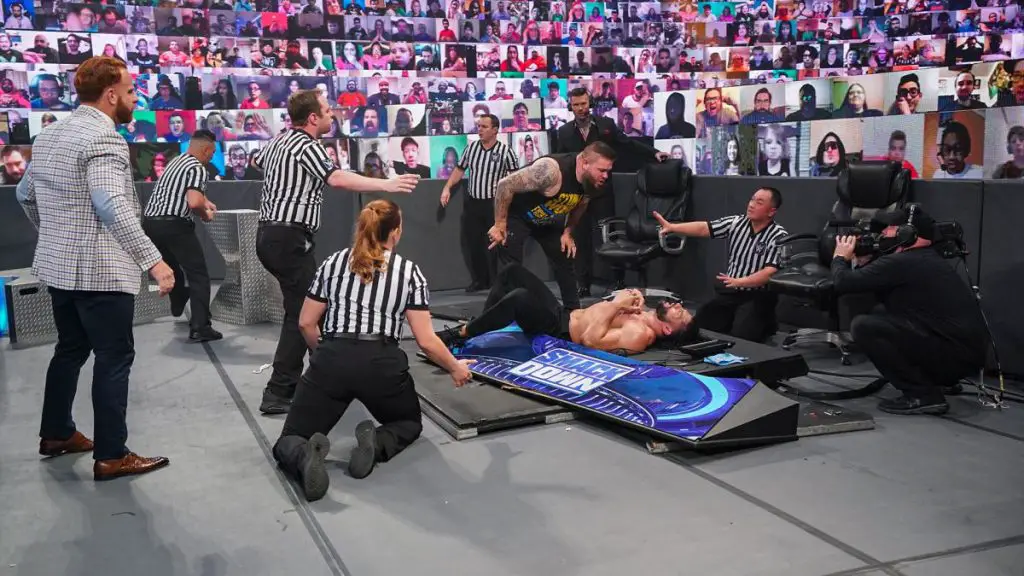 Kevin Owens sent Roman Reigns through a table