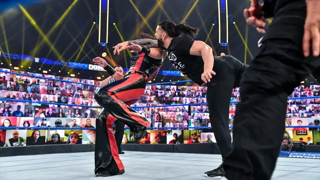 Roman Reigns hits Shinsuke Nakamura on WWE SmackDown last week. (WWE)