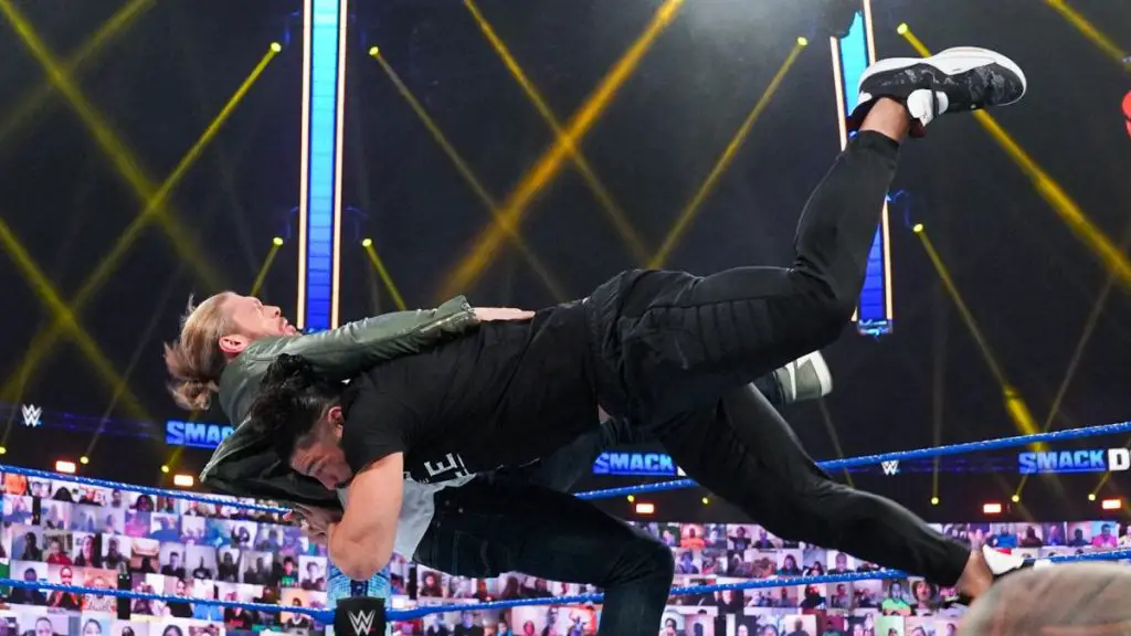 Roman Reigns spears Edge on WWE SmackDown