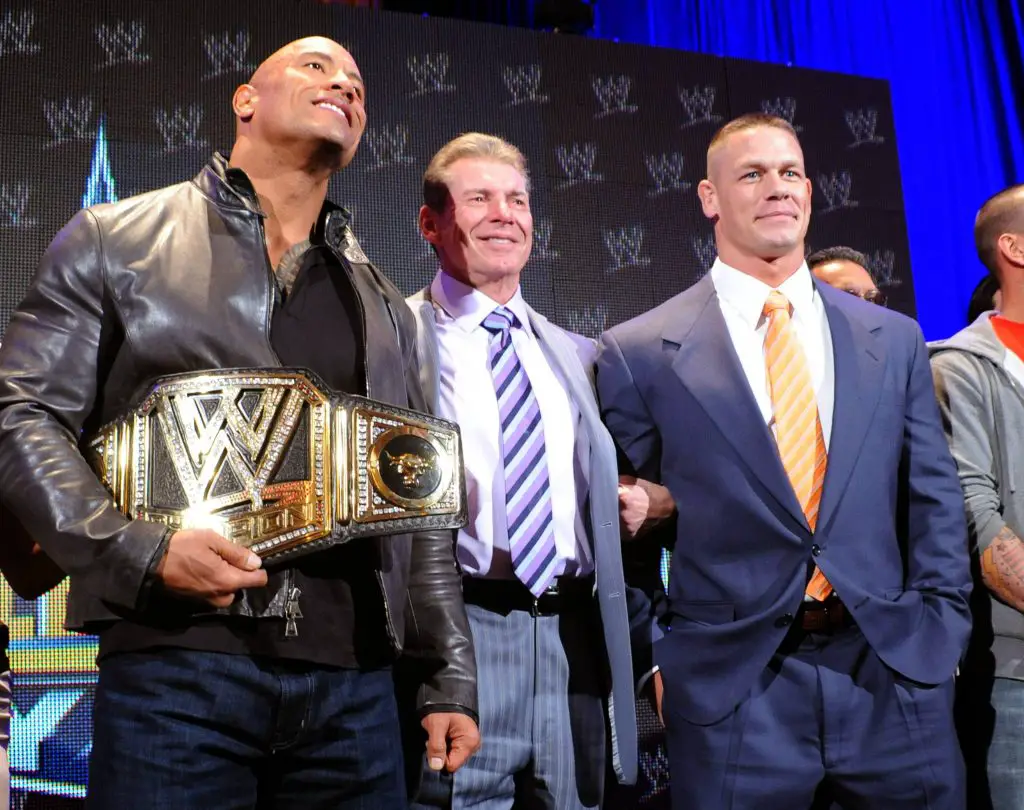 Vince McMahon (C) with The Rock (L) and John Cena (R). (imago Images)