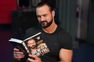 Drew McIntyre pictured reading his book, 'A Chosen Destiny'.