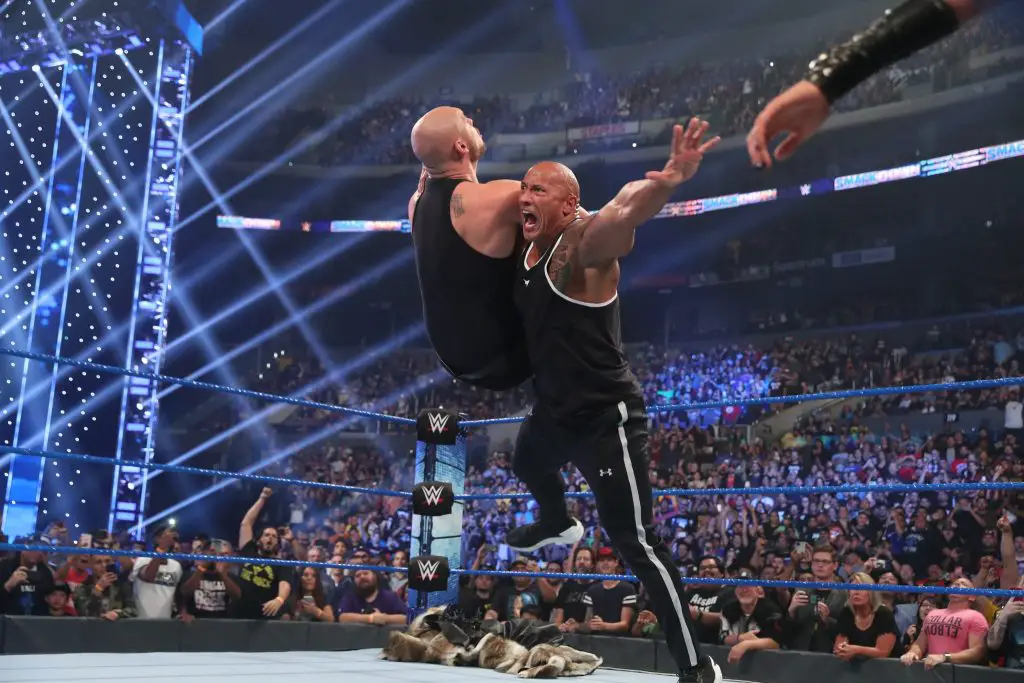 The Rock handing Baron Corbin a beatdown at SmackDown's 20th anniversary. (WWE)