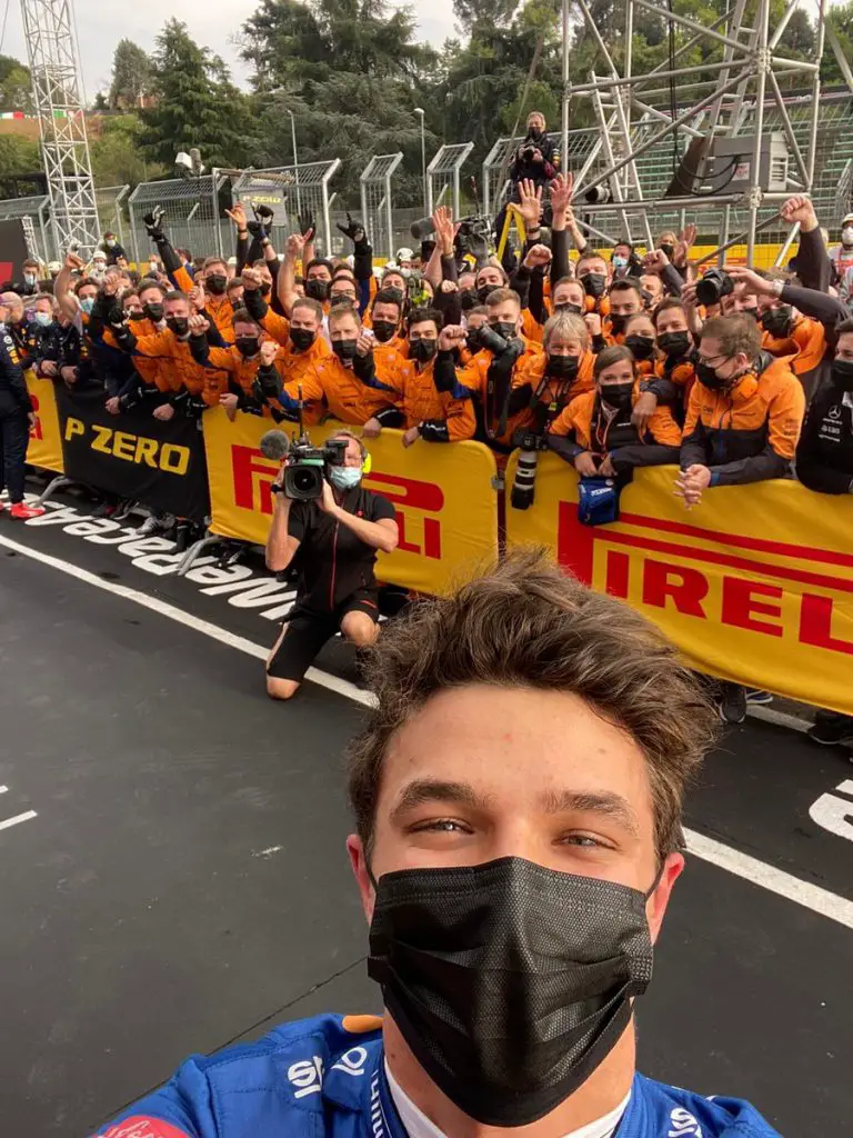 Lando Norris celebrates with the McLaren team at Imola 2021