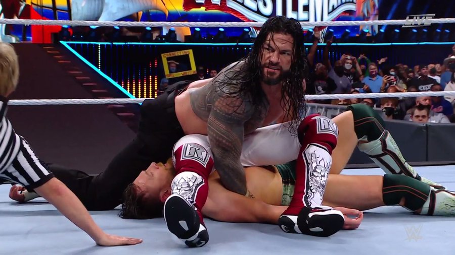 Roman Reigns pins Daniel Bryan and Edge at WrestleMania 37. (WWE)