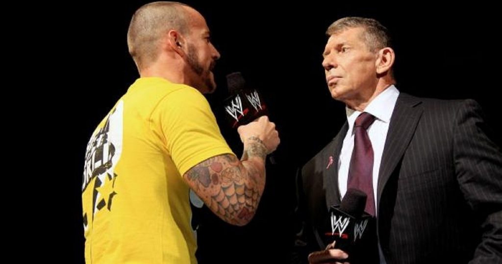 CM Punk with Vince McMahon during his time at WWE.