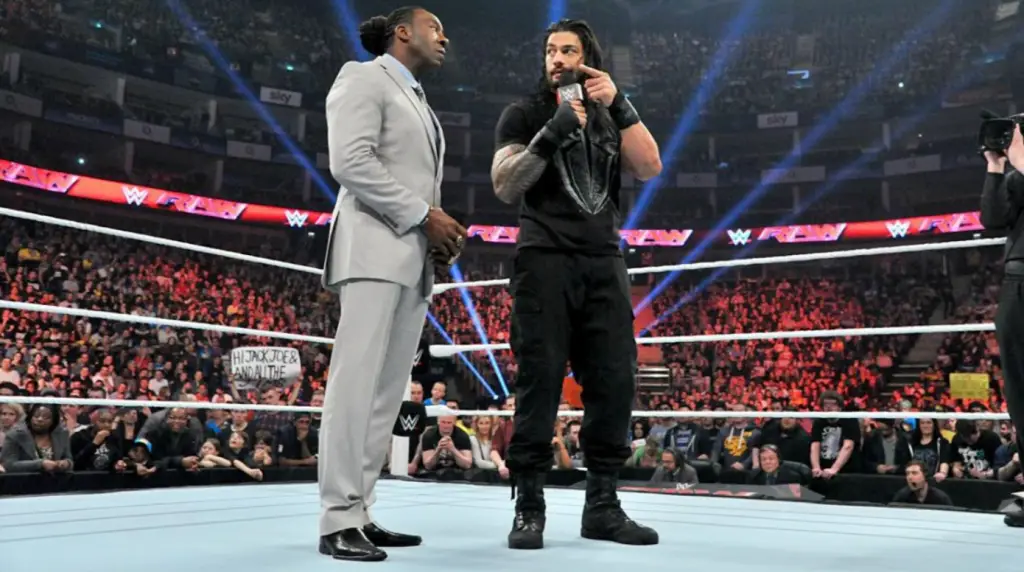 Roman Reigns with Booker T on RAW before being attacked by Big Show. (WWE)