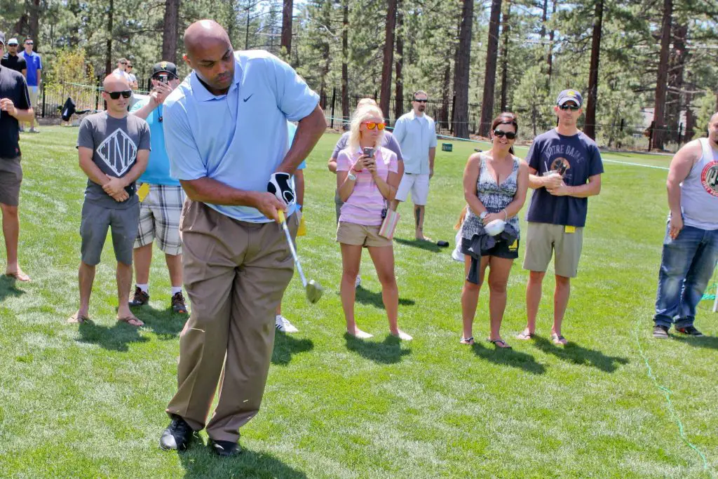 Charles Barkley tries off his hand in golf
