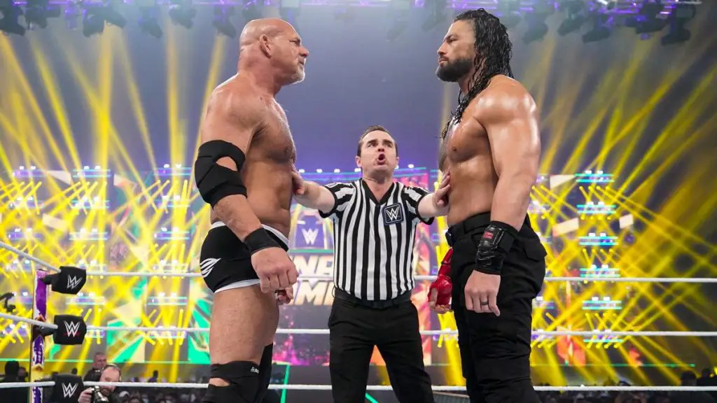 Goldberg and Roman Reigns face off at Elimination Chamber