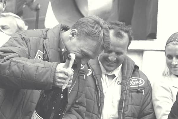 dan gurney and aj foyt on victory rostrum