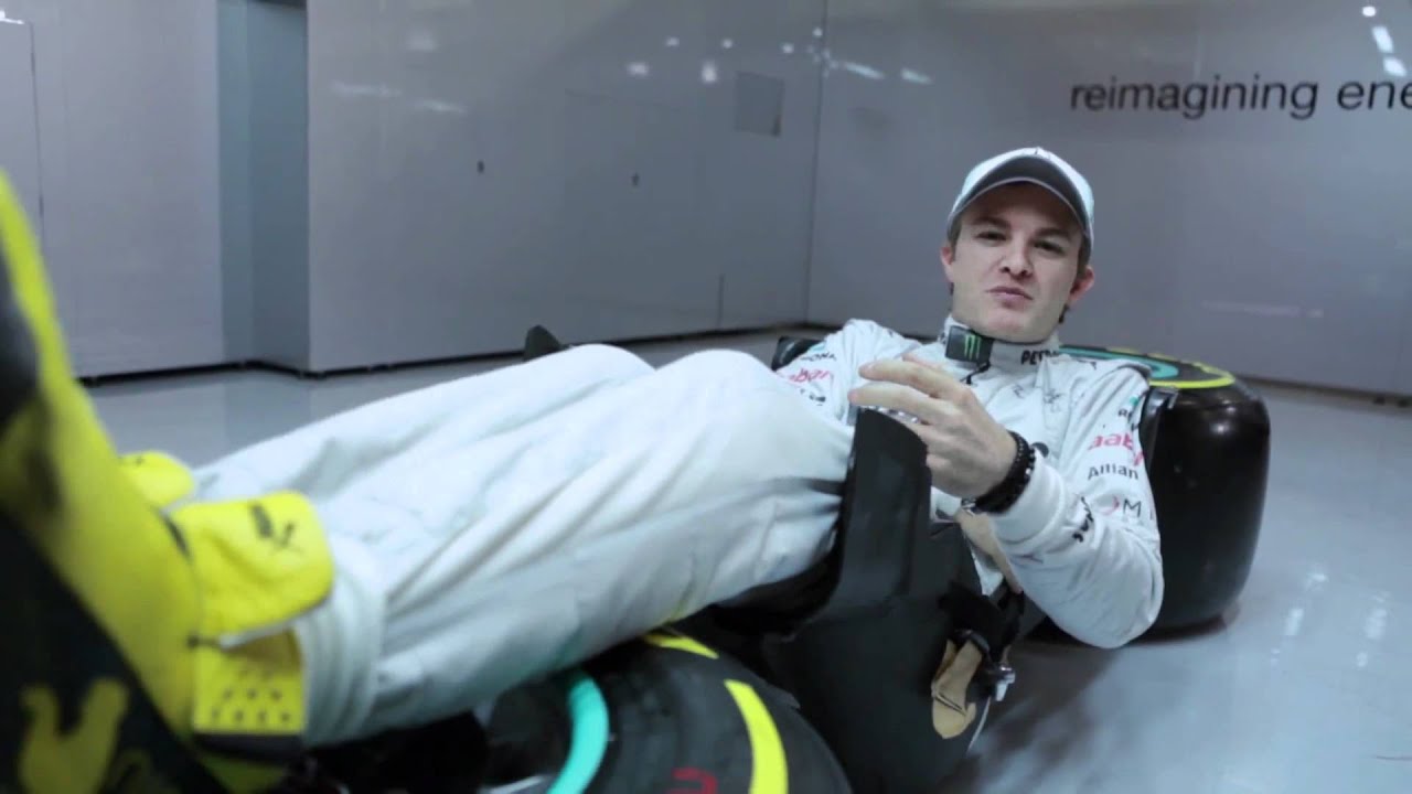 F1 Drivers sit in car